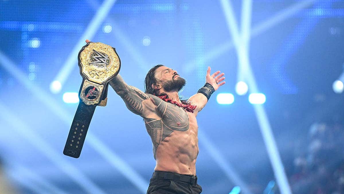 Roman Reigns celebrating after winning World Heavyweight Champion title at Allegiant Stadium