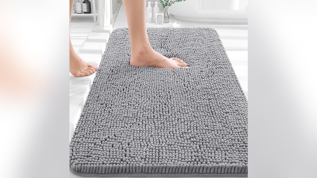 A plush bath rug that dries fast and resists slipping.
