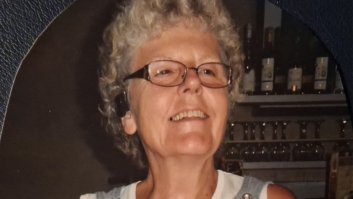 Ruth Dalton standing and smiling