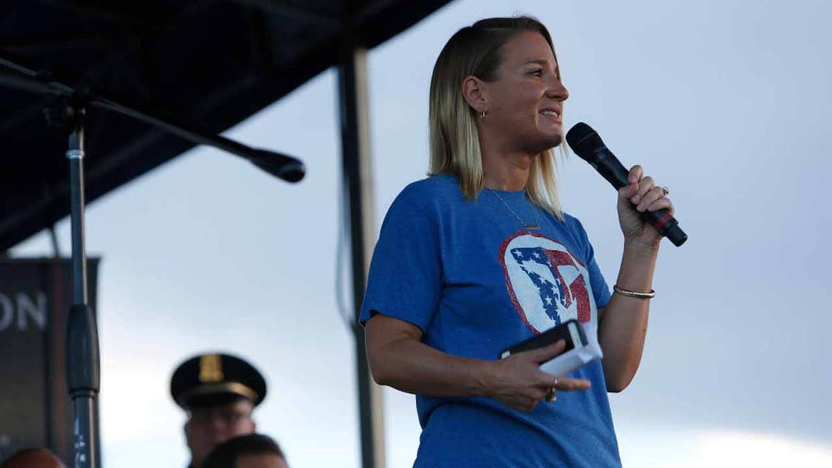 Ryan Manion Borek speaking to participants at 9/11 Heroes Run ceremony in Houston