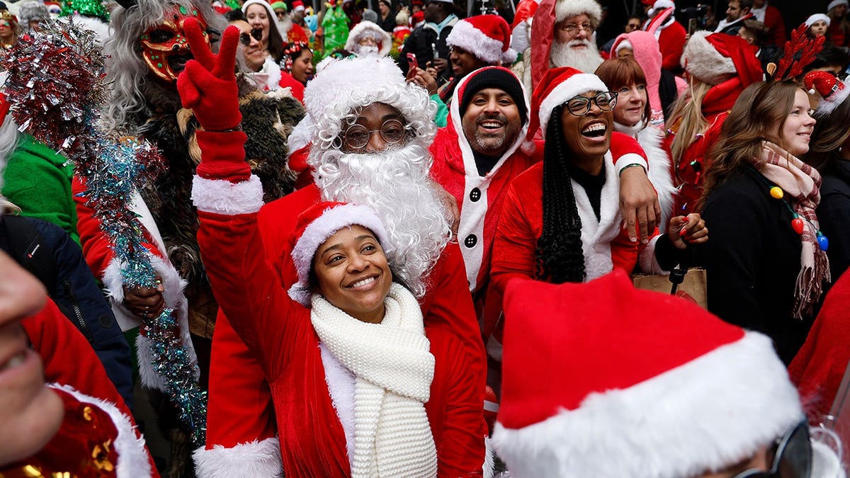 People dressed in Santa Claus costumes walking in New York City during SantaCon