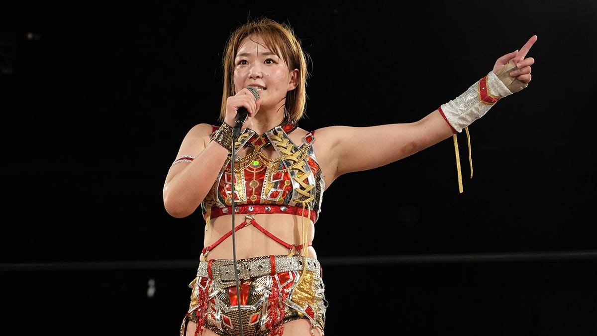 Sareee speaking during a women's pro-wrestling event at Shinjuku FACE in Tokyo