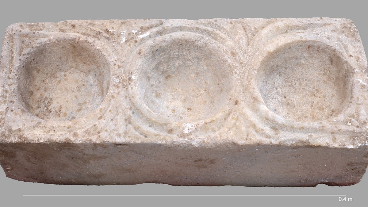 Ancient 1,400 year old marble artifact with three hemispheric cavities discovered at Hippos Sussita cathedral near the Sea of Galilee in Israel