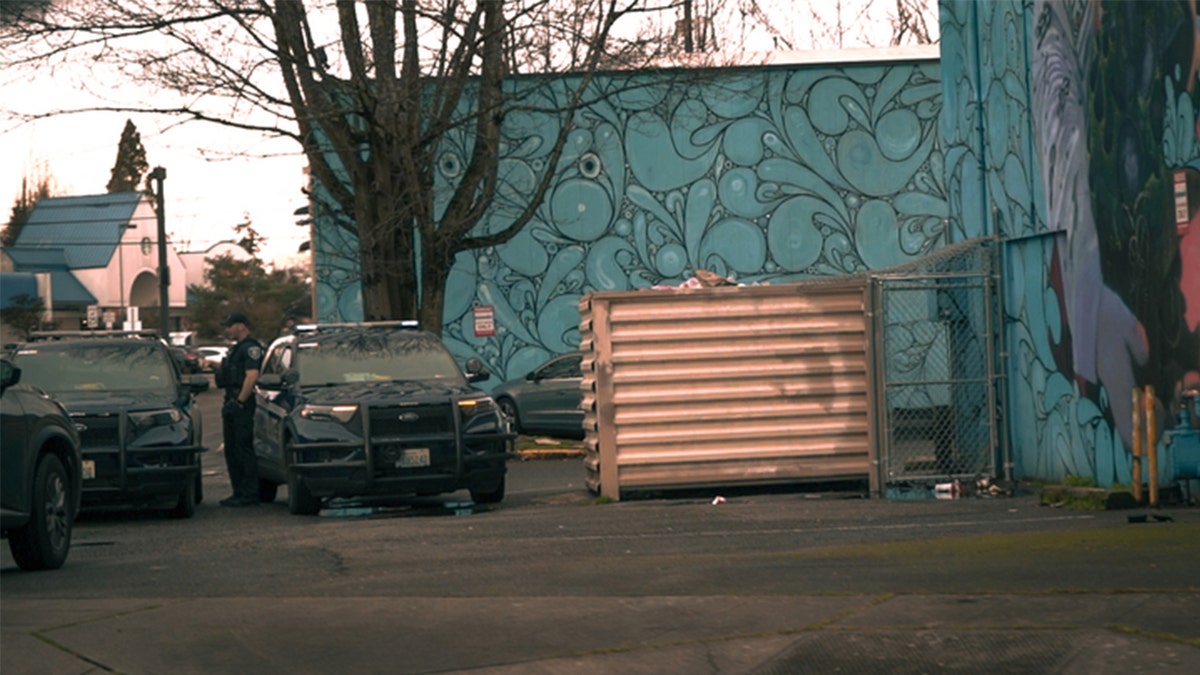 Seattle police officers talking outdoors in uniform