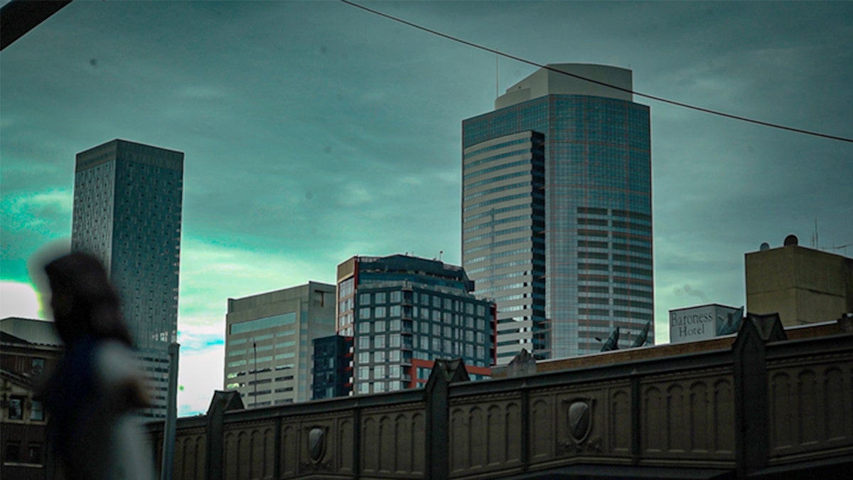 The Seattle city skyline with high-rise buildings under a clear sky.