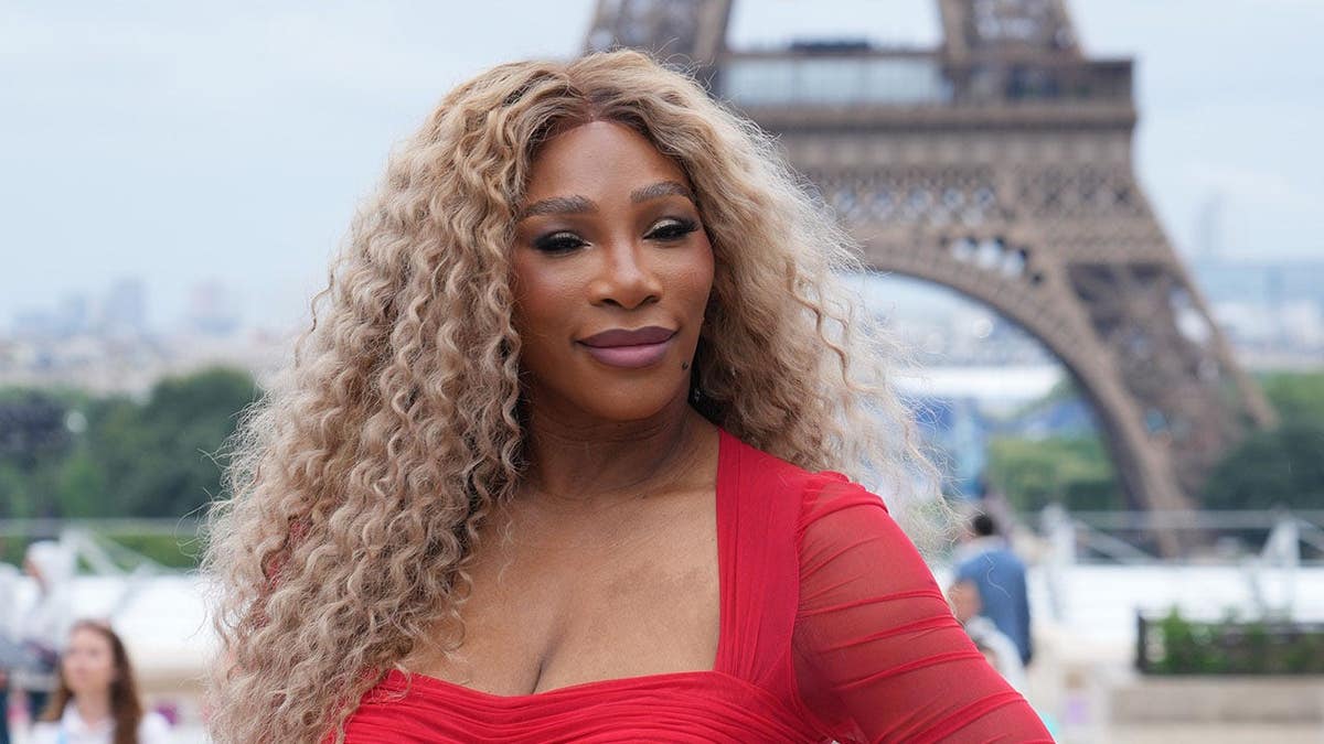 Serena Williams walking on the red carpet along the Seine River in Paris