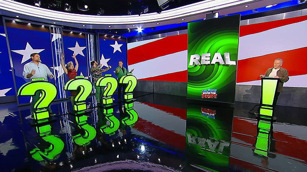 Contestants and Greg Gutfeld stand on the stage during the high-stakes game show,