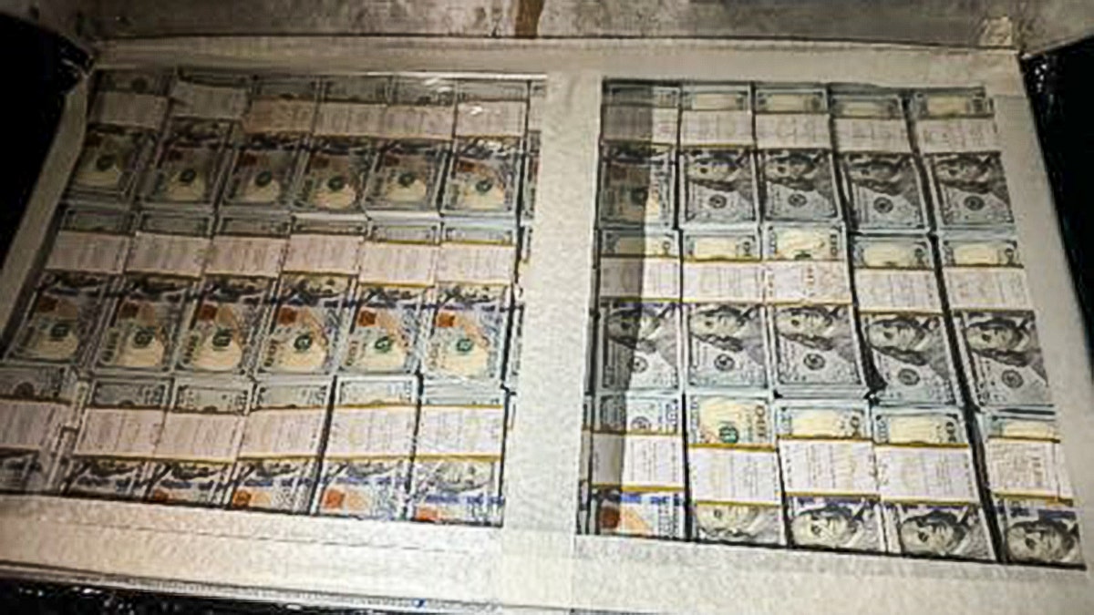 Photo of a large quantity of hundred dollar bills.