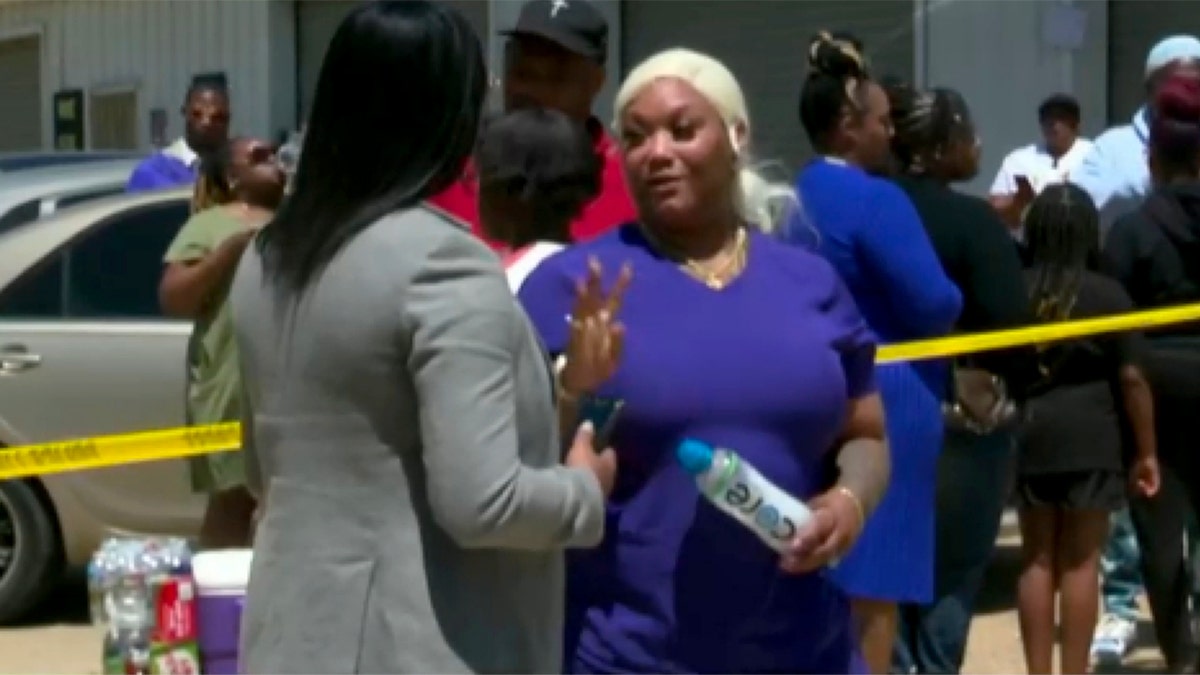 Residents gather behind police tape in Shreveport after domestic shooting