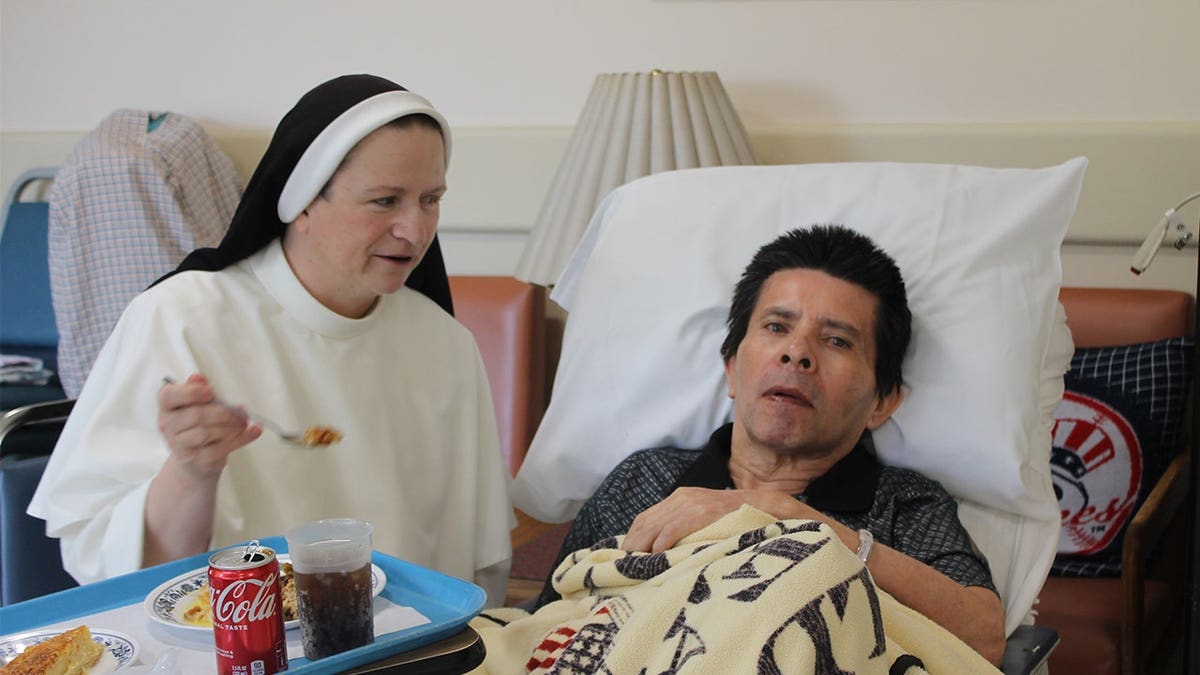 sister-feeds-resident