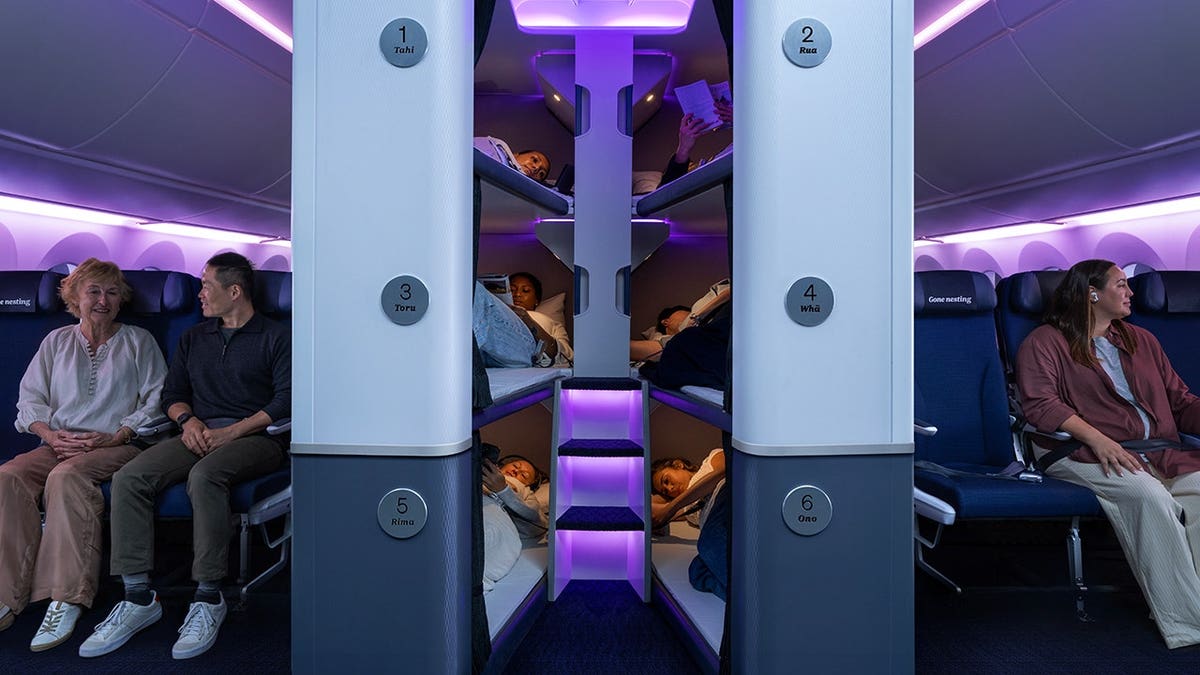 Air New Zealand plane with bunk beds and economy seating.