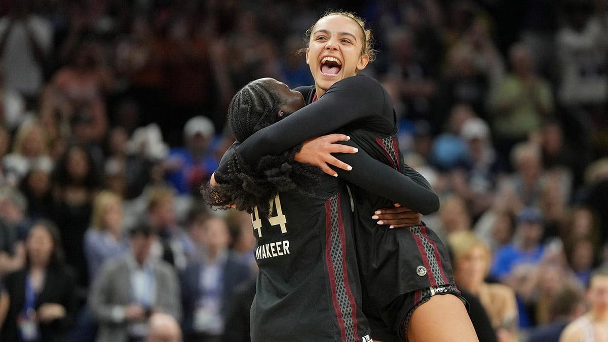 South Carolina guards Tessa Johnson and Agot Makeer celebrating connected hoops court