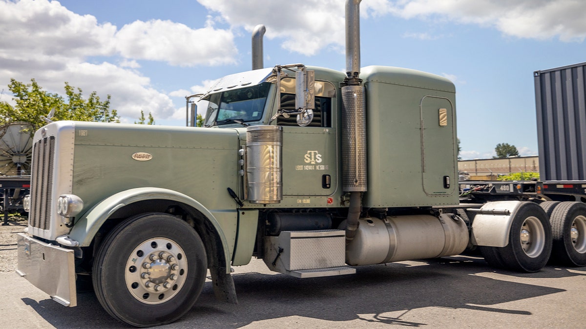 A truck with "STS" written on the door