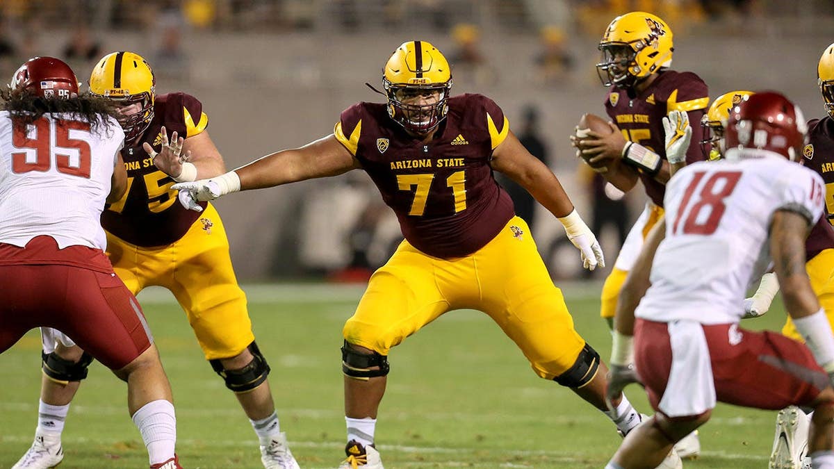 Arizona State Sun Devils offensive lineman Steven Miller blocking during football game at Sun Devil Stadium