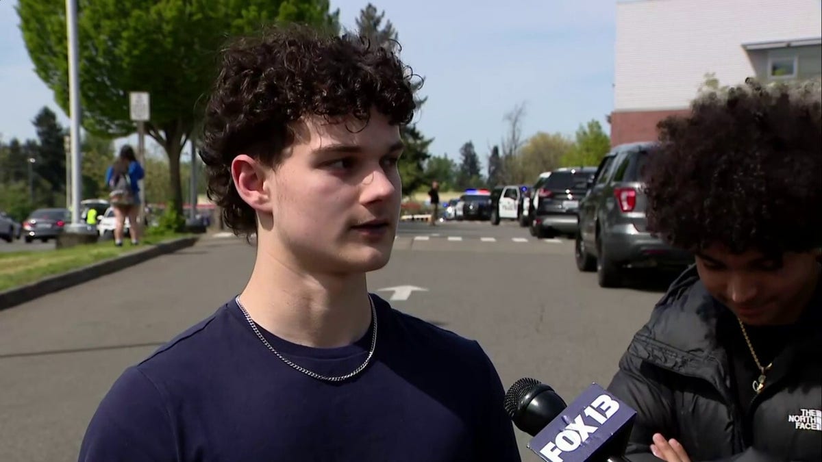 A high school student speaking to a reporter