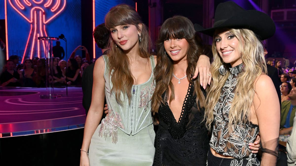 Taylor Swift, Ella Langley, and Lainey Wilson at 2026 iHeartRadio Music Awards