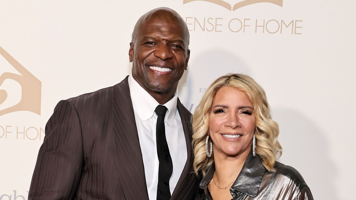 Terry Crews and Rebecca Crews standing together at an event in West Hollywood