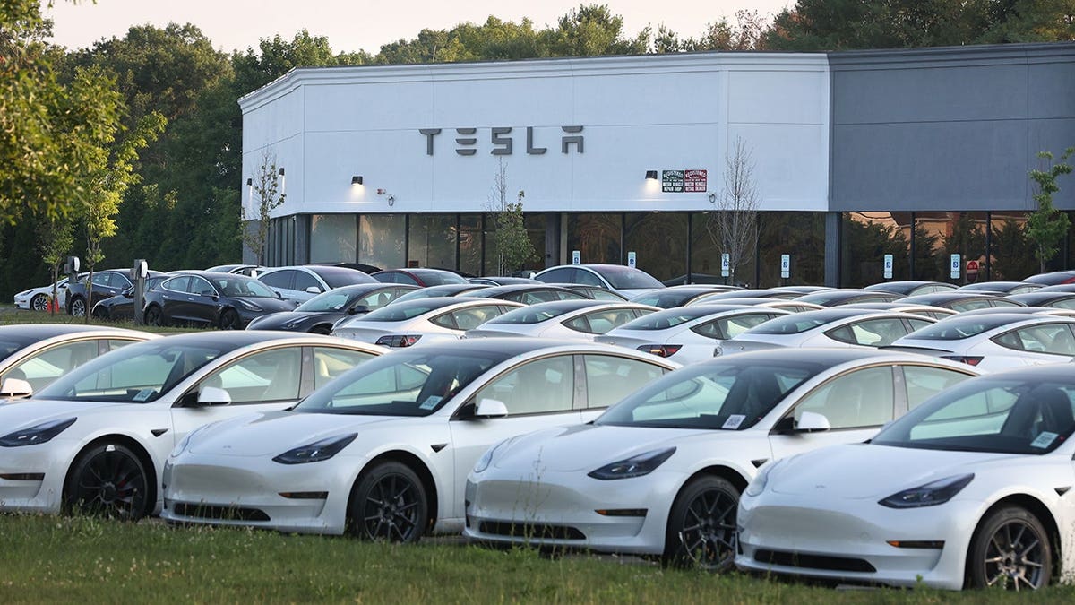 New Tesla electric vehicles parked at a Tesla retail location in Smithtown, New York