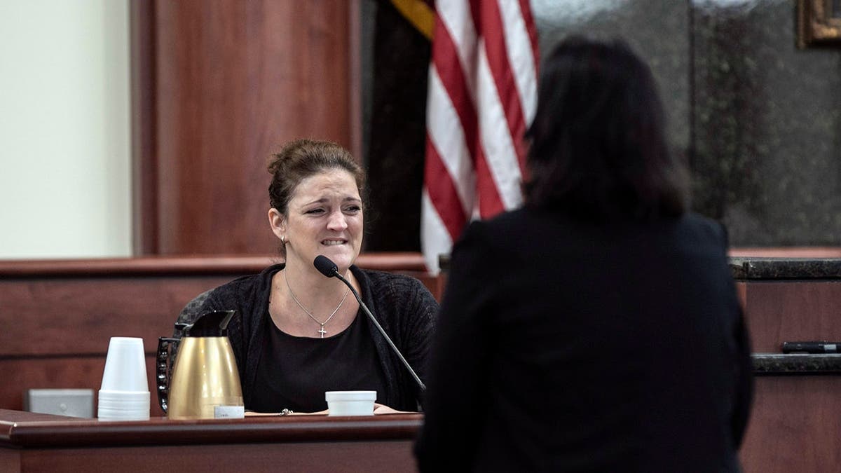 Deputy Solicitor Suzanne Mayes questioning Amber Kyzer in courtroom.