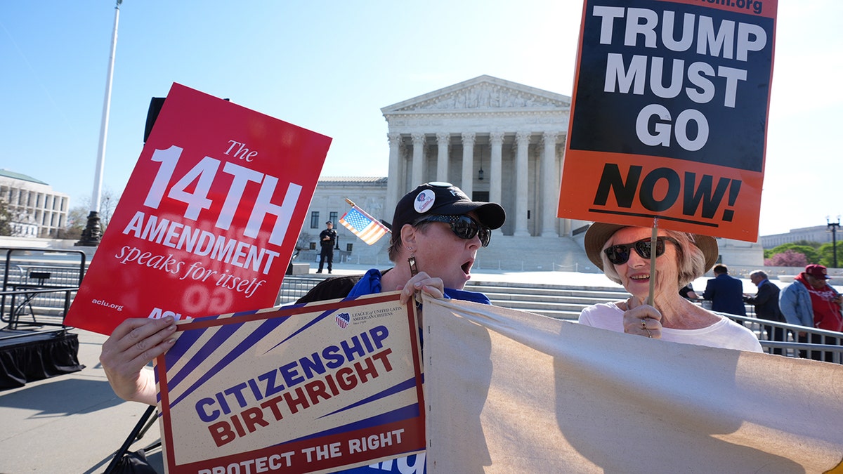 Pro and anti-Trump demonstrators rallying with signs outside the U.S. Supreme Court building.