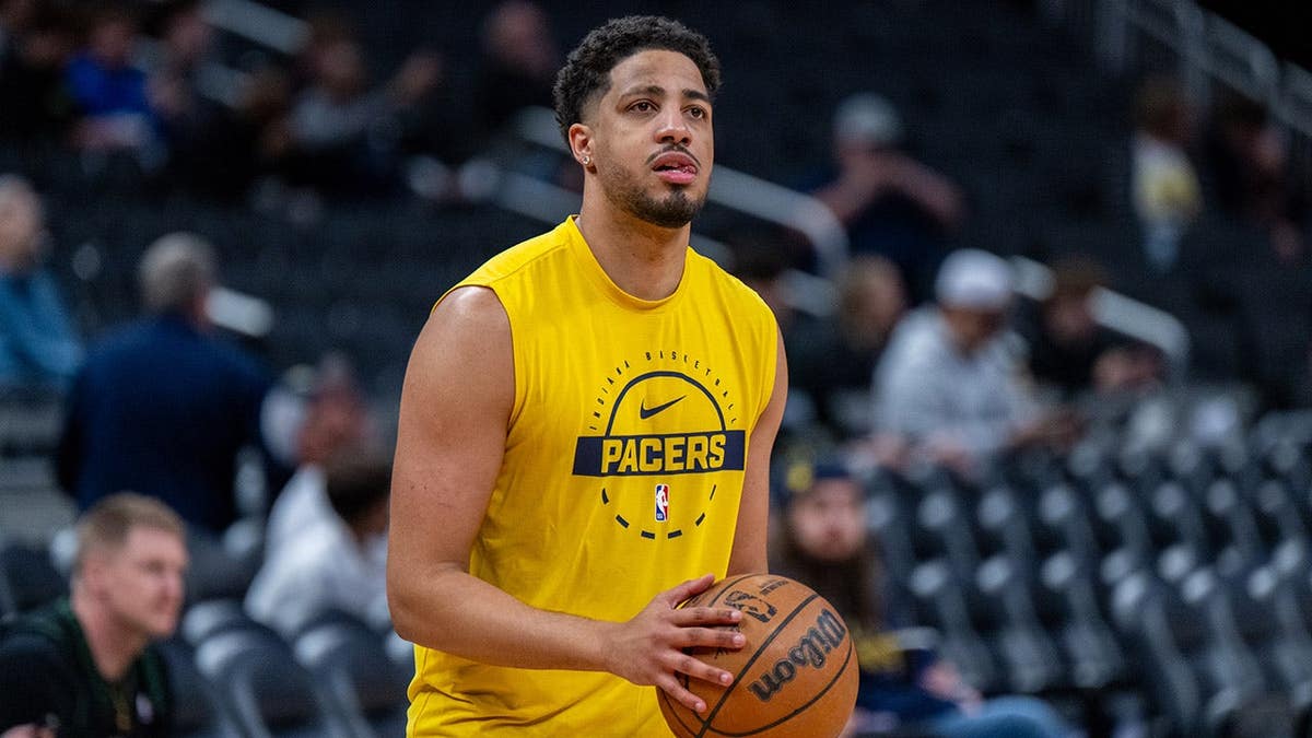 Indiana Pacers guard Tyrese Haliburton shooting basketball on court