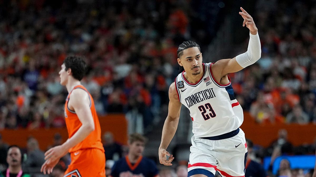 UConn forward Jayden Ross celebrating a shot during a basketball game.