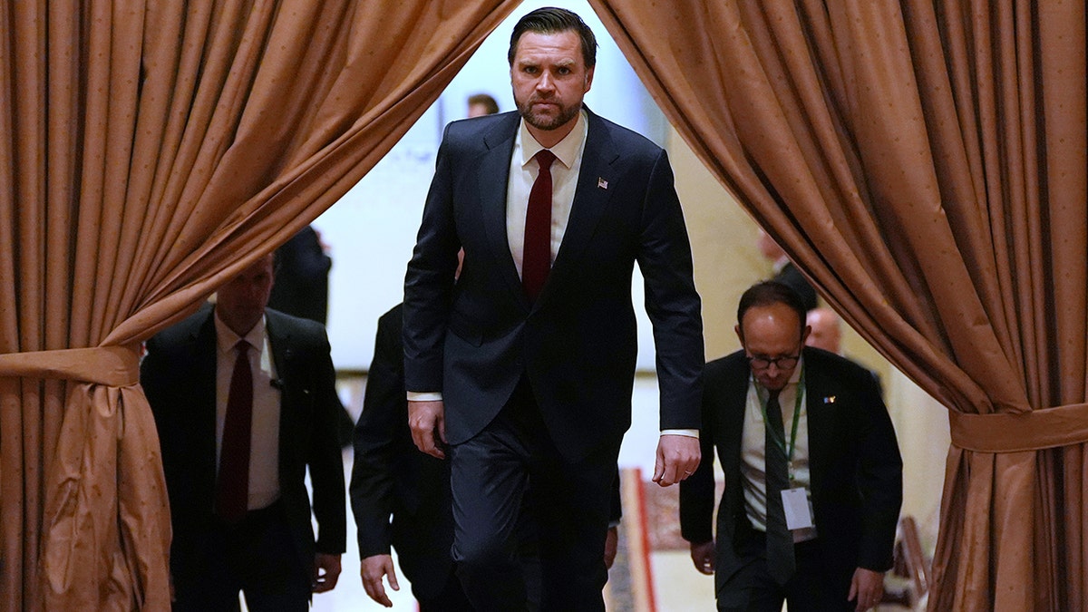 JD Vance arriving for a meeting in a formal room with officials.