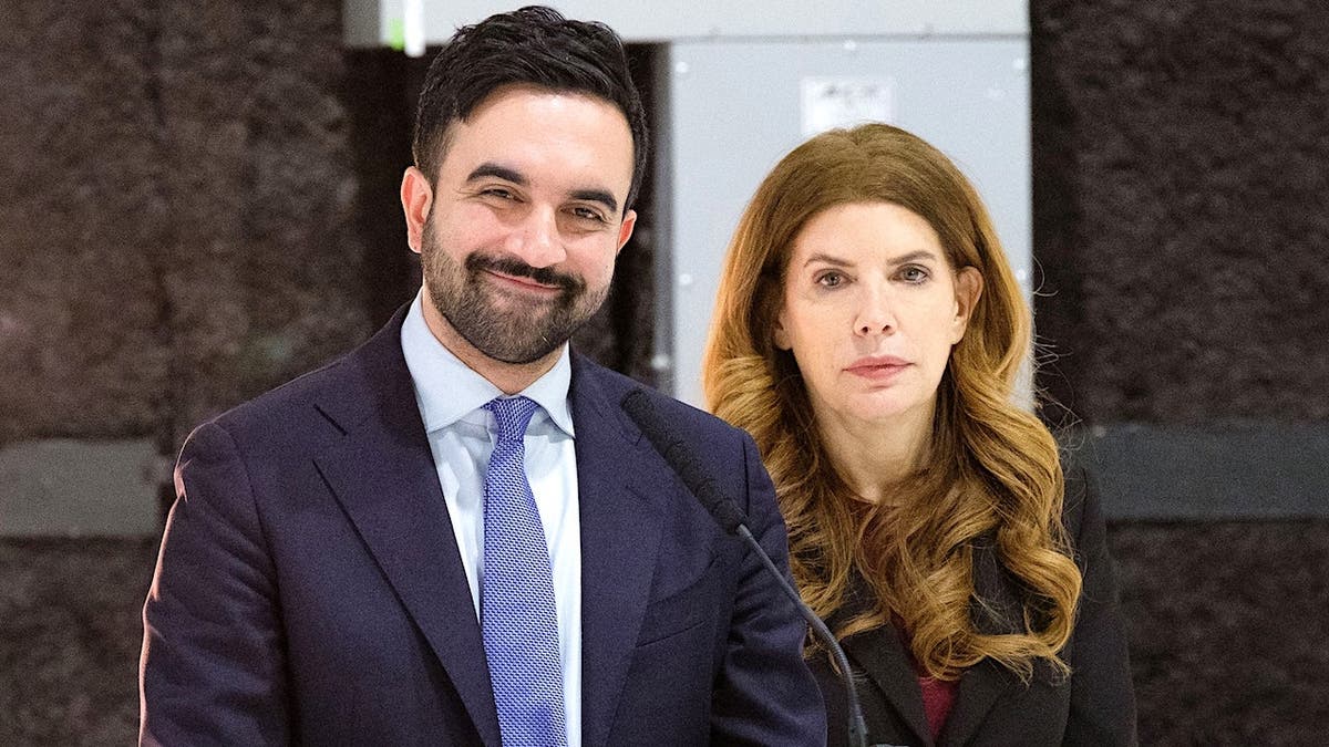 Mayor Zohran Mamdani and City Council Speaker Julie Menin standing at a press conference in Red Hook Brooklyn
