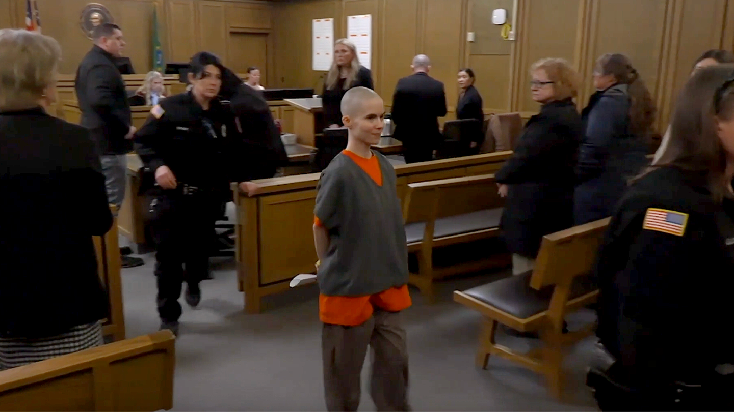 Bald-headed killer smiles as prosecutors reveal what she did before dad walked in