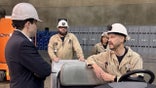 Acting Secretary Sonderling chats with apprentices during a visit to the famous Hoover Dam