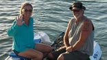 Brian and Lynette Hooker on dinghy