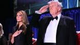 First Lady Melania Trump and President Donald Trump standing together at the White House Correspondents' dinner.