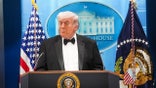 President Donald Trump speaking during a press conference in the White House briefing room