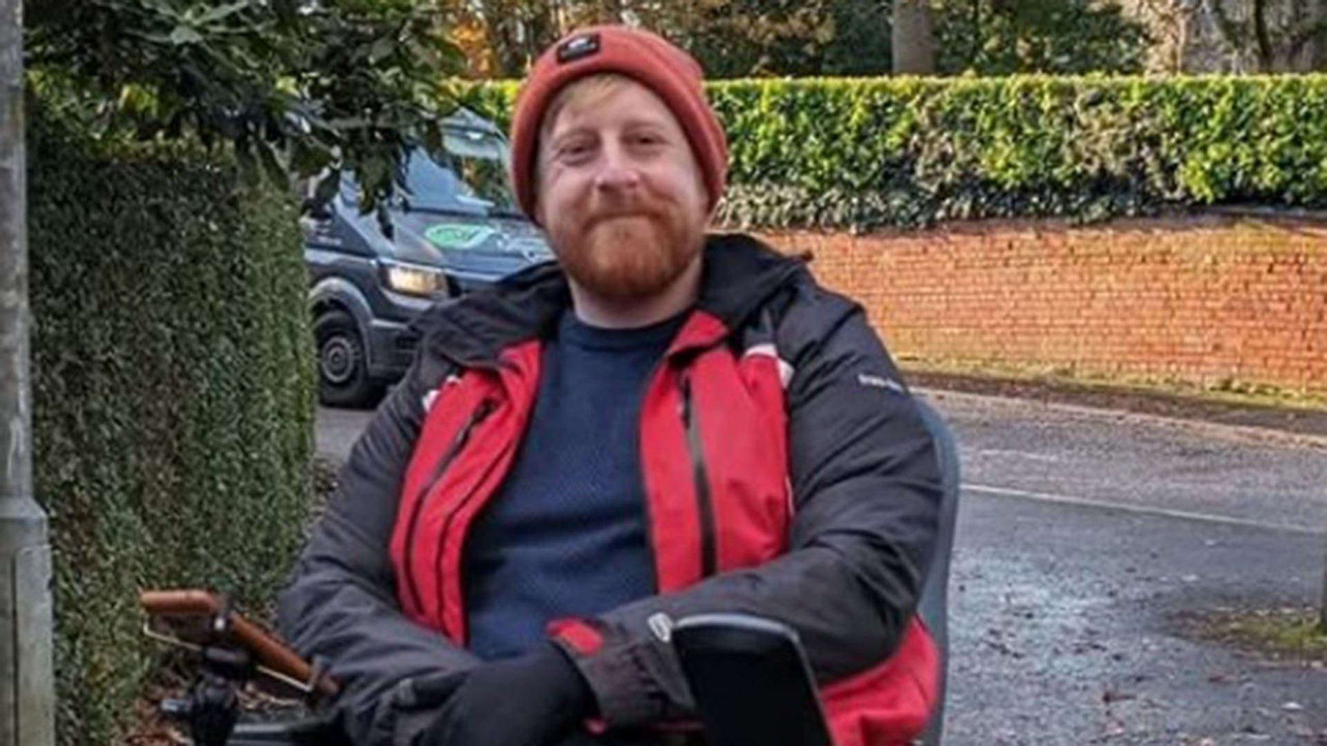 Michael Patrick in a coat and beanie in November 2023.