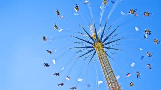 Startling footage from amusement park shows thrill ride halted as guests wait in midair