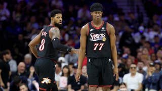 Fan drilled with errant pass while on her phone sitting courtside at NBA play-in tournament