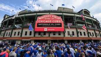 Cubs fan caught working on laptop during freezing 40-degree game at Wrigley - Fox News
