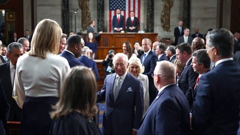 Ilhan Omar caught smiling and snapping photos of Charles after joining protest rallies - Fox News