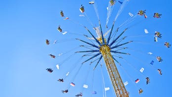 Startling footage from amusement park shows thrill ride halted as guests wait in midair
