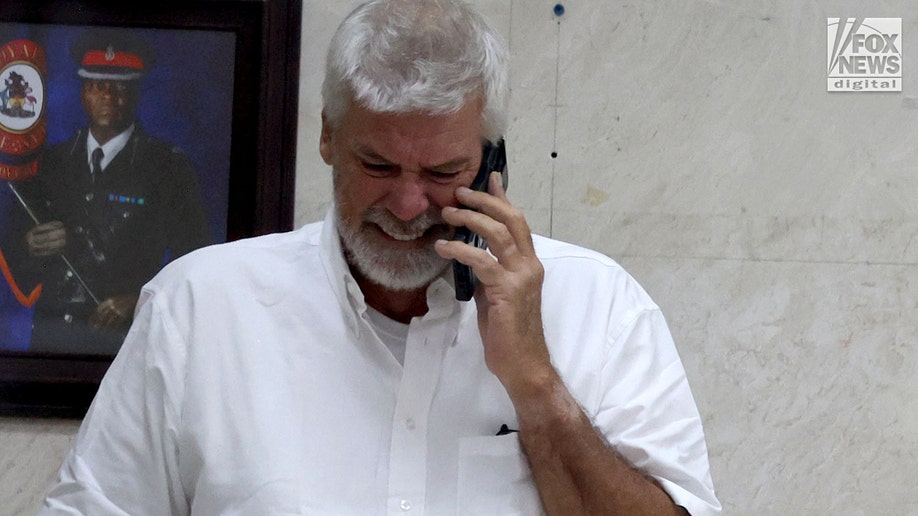 Brian Hooker leaves police station in The Bahamas, with lawyer