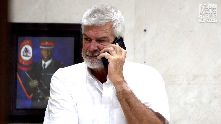 Brian Hooker leaves police station in The Bahamas, with lawyer