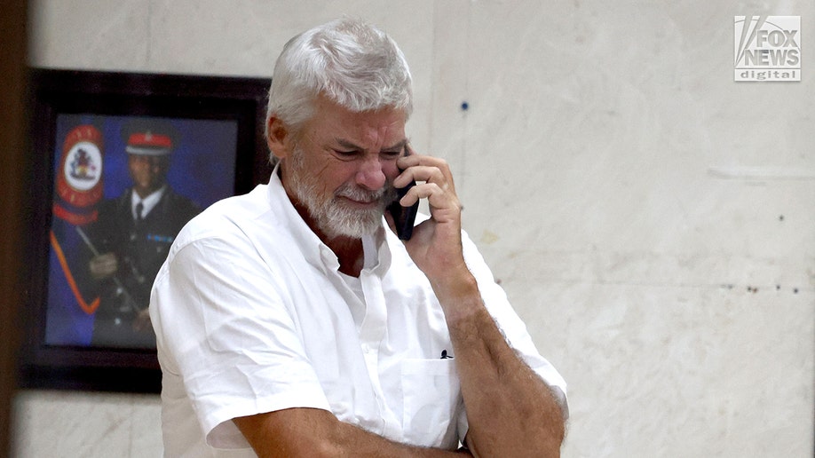 Brian Hooker leaves police station in The Bahamas, with lawyer