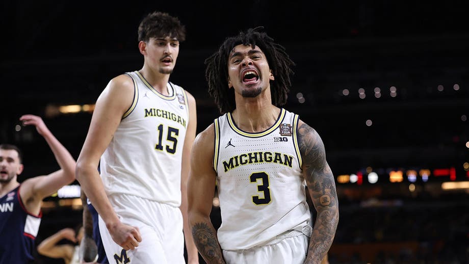 Michigan holds off UConn to capture first men's basketball national title since 1989