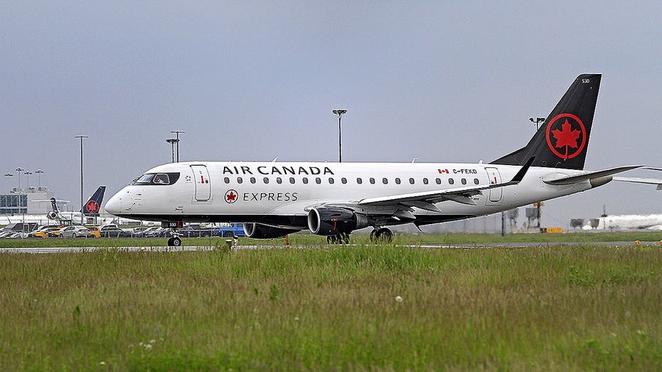 Air Canada flight with 61 passengers diverts to Boston after captain is removed from cockpit midair