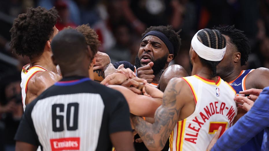 Two players ejected after scrum amid Knicks' 50-point lead vs. Hawks sends referee crashing to the court