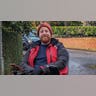 Michael Patrick in a coat and beanie in November 2023.