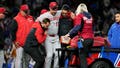 Reds closer carted off field after sustaining leg injury just one pitch into appearance - Fox News