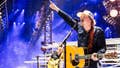 Morgan Wallen fan goes viral kicking a phone out of someone's hand as she's being escorted out in handcuffs - Fox News