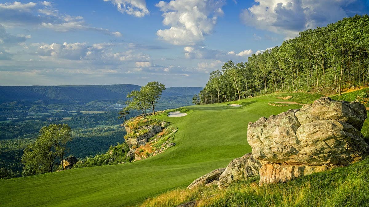 scenic 18th hole on a cliffside golf course