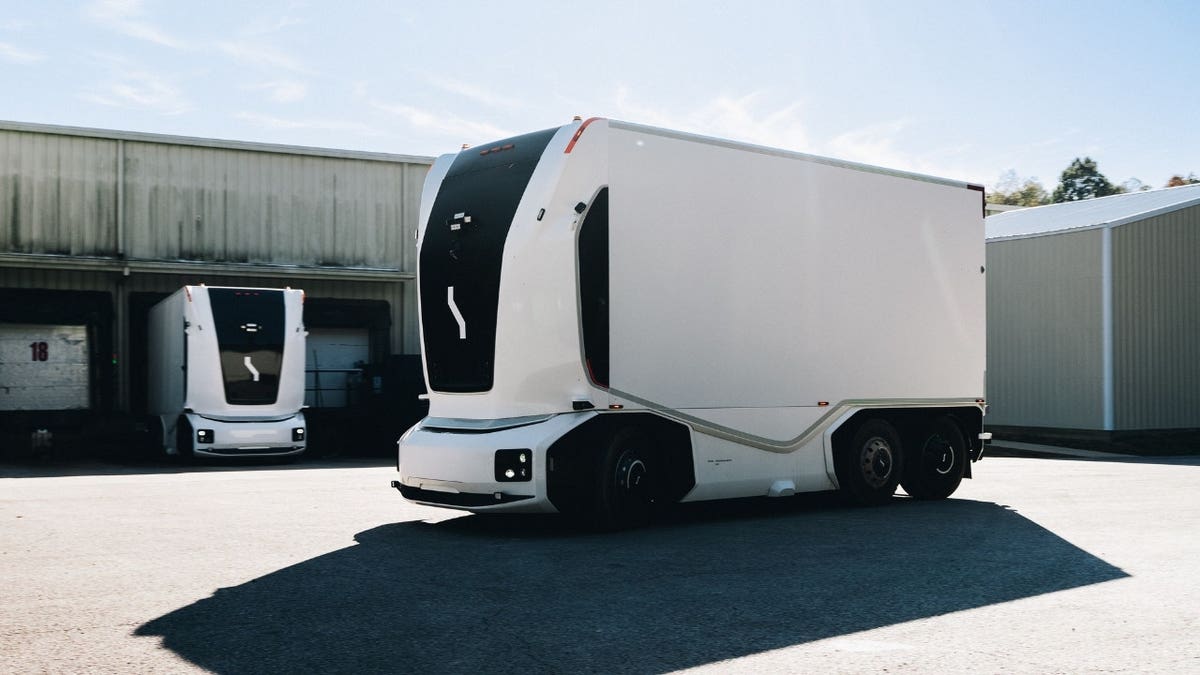 Driverless semi parked on a lot.